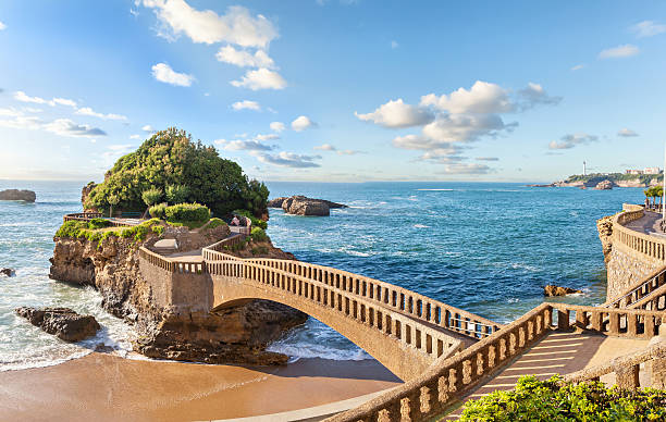 10 Best Places To Visit In Europe In Summer Stone bridge leading to the Rocher de la Vierge in Biarritz, an elegant resort on the Basque coast - Image by iStockphoto.com